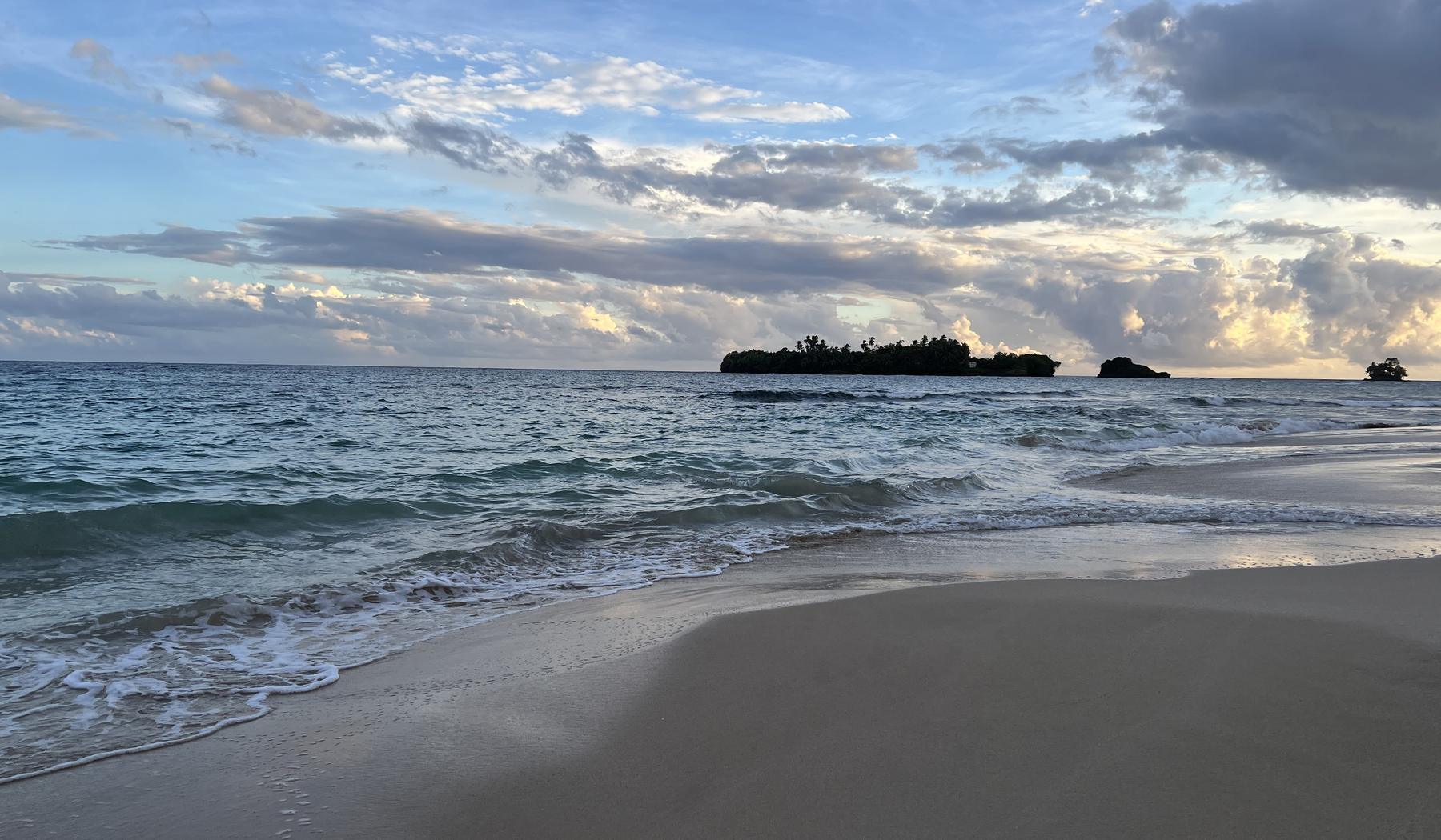 Beach at dusk with island silhouette, Bocas del Toro